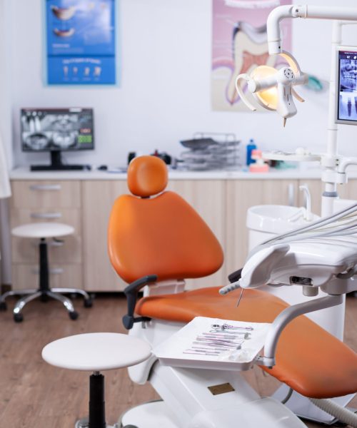 Dentist's office interior with modern chair and special dentisd equipment. The interior of stomatology clinic.