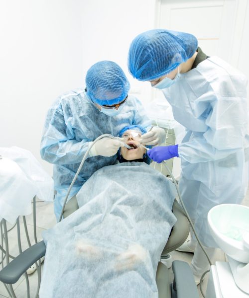 doctors-treat-teeth-patient-dental-office-sitting-chair