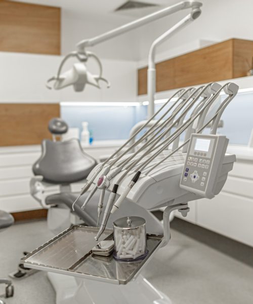 Stomatology instruments on stomatology cabinet background. Oral health concept.